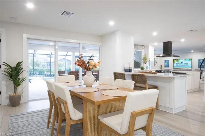 Dining area with light hardwood / wood-style floors