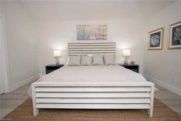 Bedroom with light hardwood / wood-style flooring