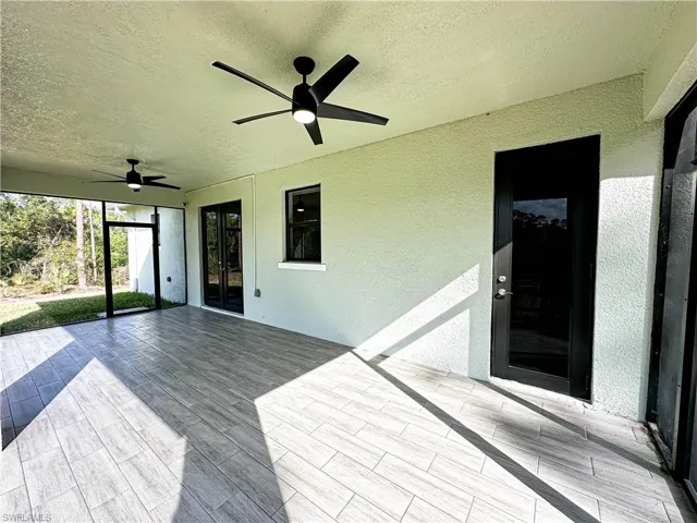 Lanai, door to Guest Bathroom, Kitchen pass through window, french doors to Great Room, 2 screen doors on either end of lanai