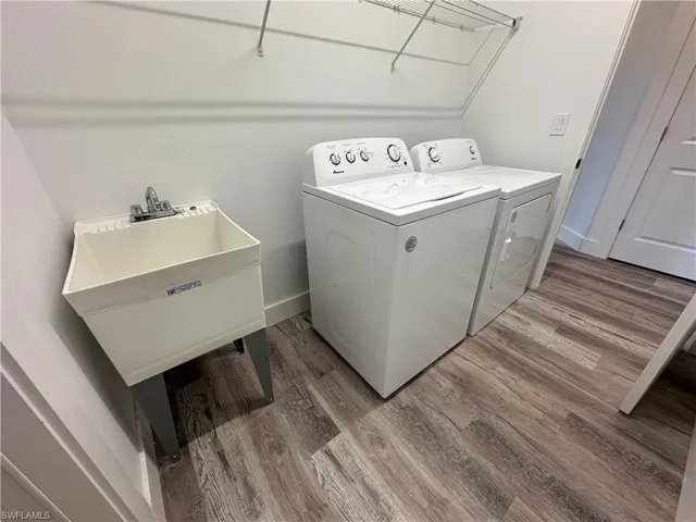 Laundry with washer and dryer, sink