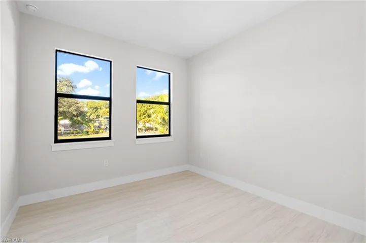 Spare room featuring baseboards