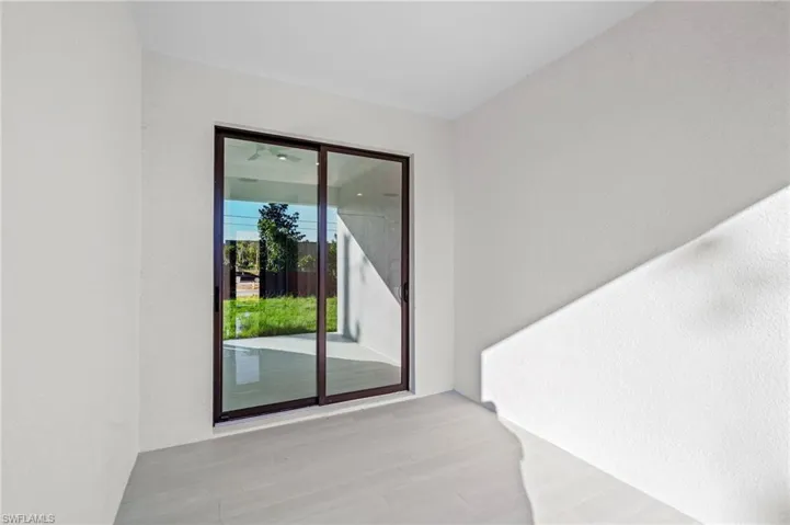 Property entrance featuring stucco siding
