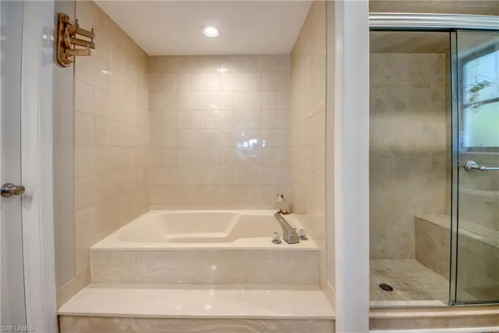 Bathroom featuring separate shower and tub