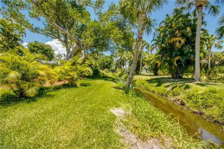 View of yard with a water view