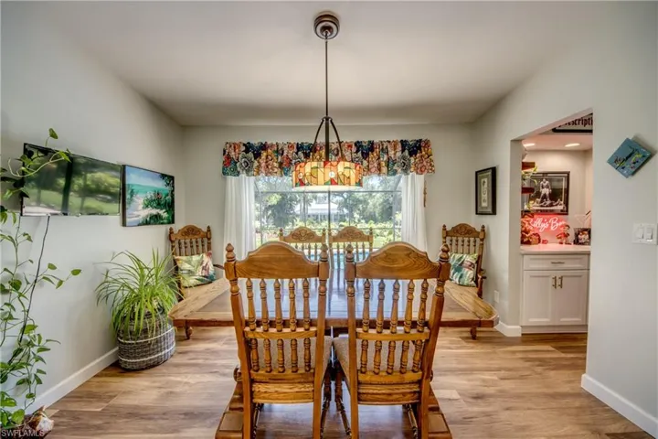 Dining area featuring a notable chandelier and light hardwood / wood-style flooring