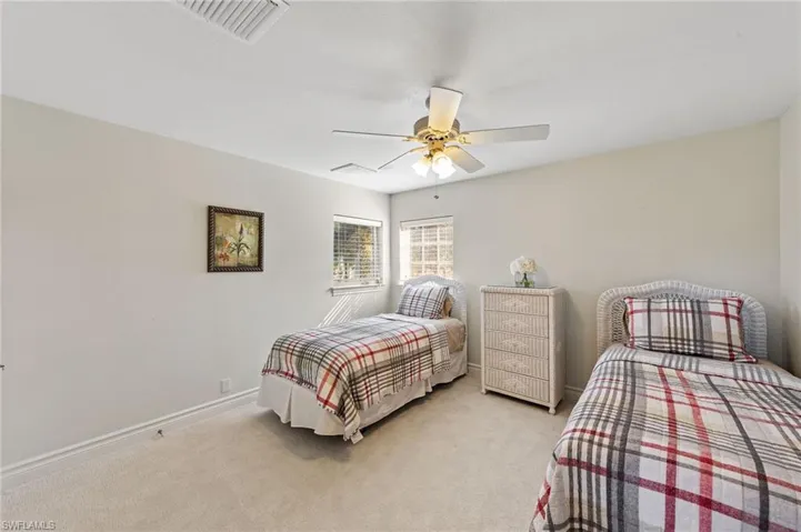 Bedroom with carpet flooring and ceiling fan