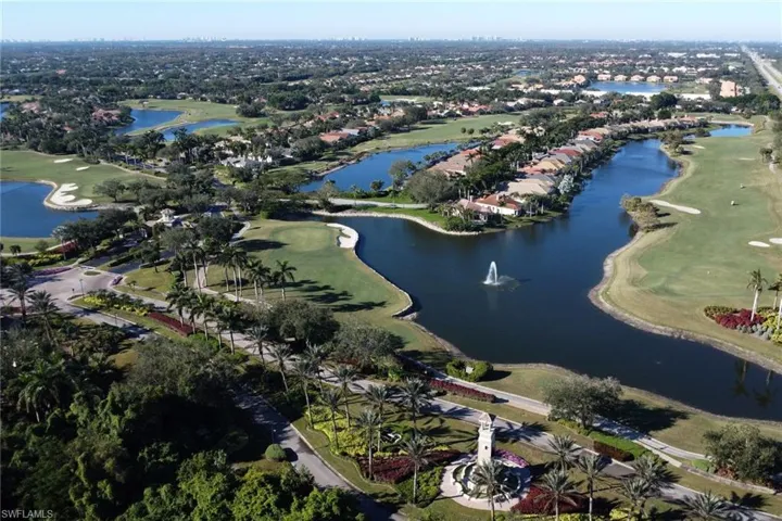 View of property location with a local golf course and nearby suburban area