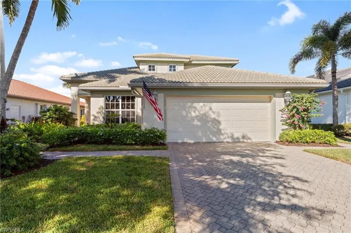 Mediterranean / spanish home featuring stucco siding, a tile roof, and decorative driveway