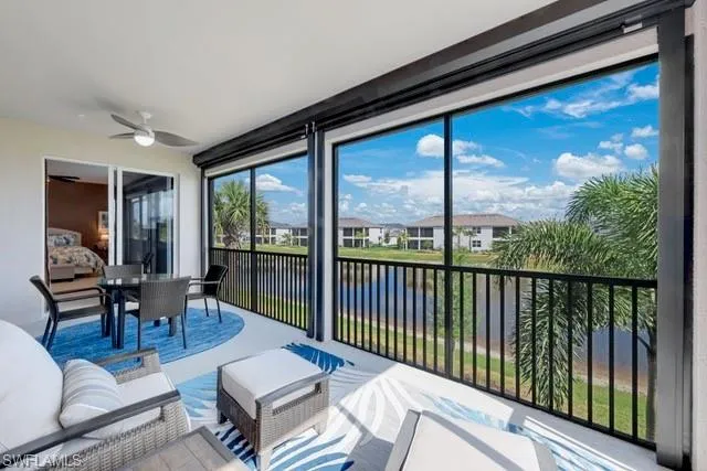 Lanai featuring a water view and electric Storm Smart shutters