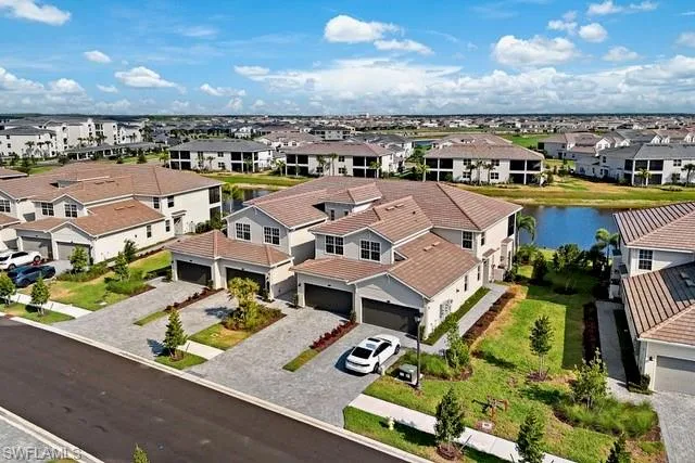 Aerial view of residential area with a large body of water