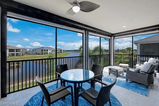 Lanai featuring a water view and electric Storm Smart shutters