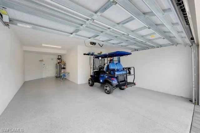 Garage featuring a garage door opener