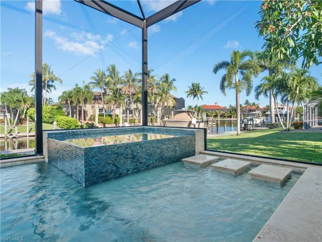 View of swimming pool with a yard