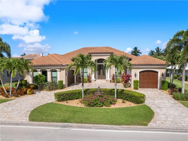 Mediterranean / spanish home featuring a garage