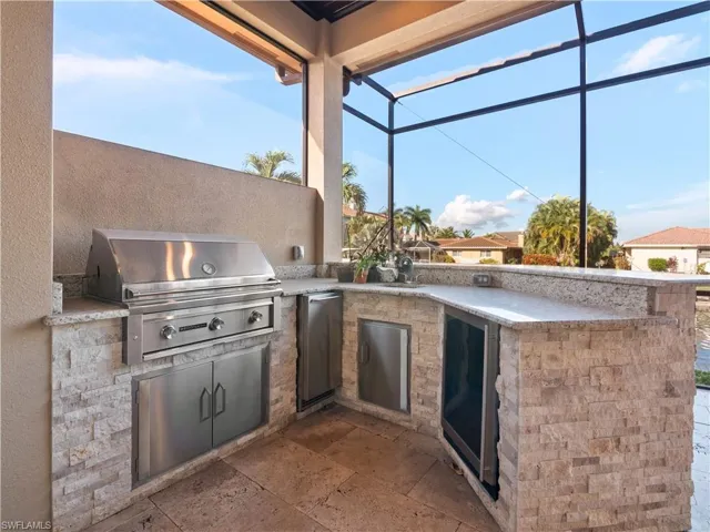 View of patio / terrace featuring a grill and exterior kitchen