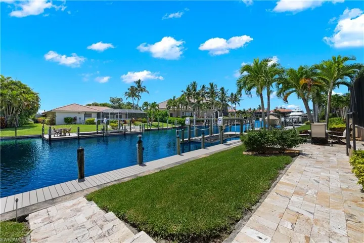 Dock area featuring a yard and a water view