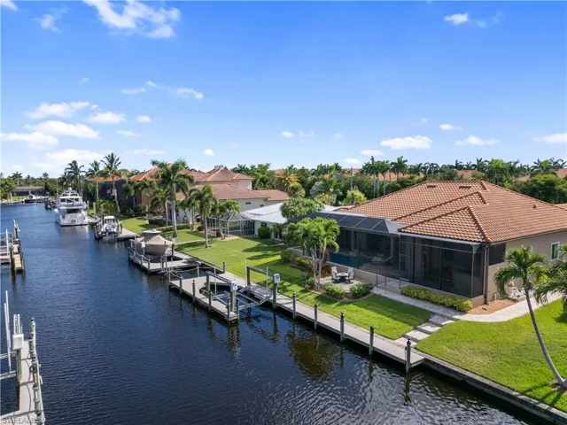 Property view of water with a dock