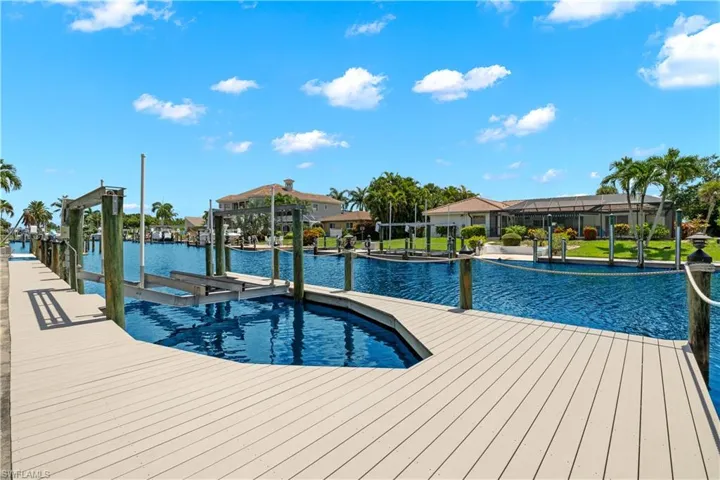 View of swimming pool with a dock