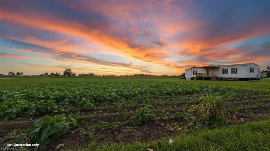 View of yard featuring a view of countryside, agricultural plots, and stairway