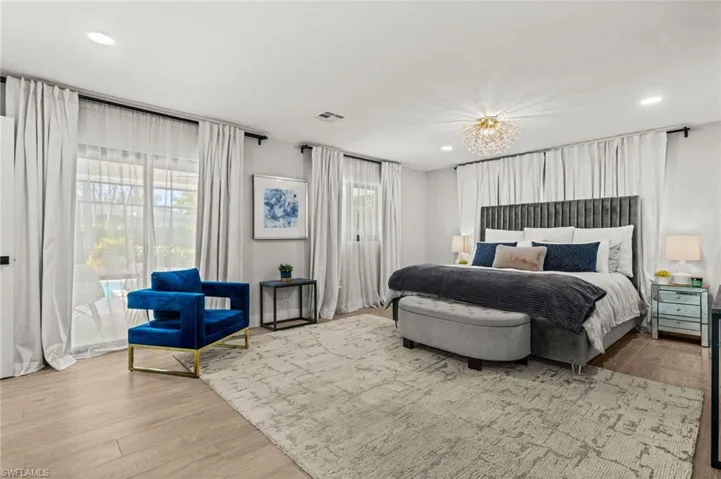 Bedroom with light wood-type flooring and recessed lighting
