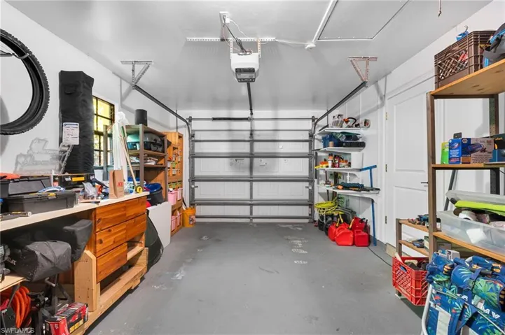 Garage featuring a garage door opener