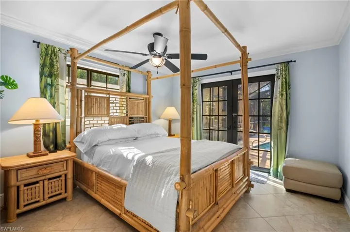 Bedroom with french doors, access to exterior, ceiling fan, crown molding, and light tile patterned floors