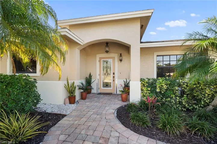 View of exterior entry with stucco siding