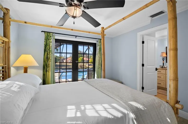 Bedroom featuring ornamental molding, french doors, access to exterior, and a ceiling fan