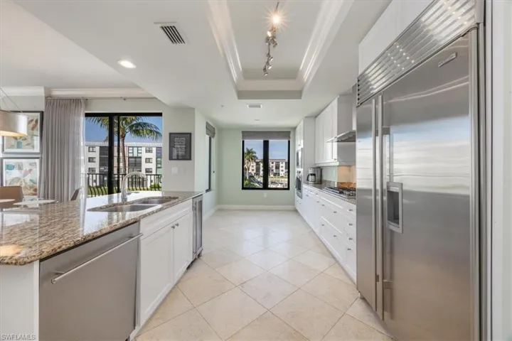 Kitchen featuring Wolf and Sub-Zero appliances and wine fridge