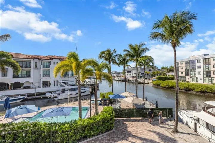 View of private pool with patio, spa, with Naples Bay and Marina views