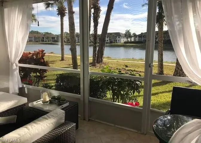 Sunroom with a water view