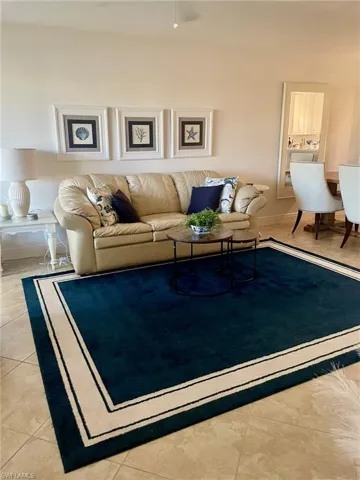 Living area with light tile patterned floors