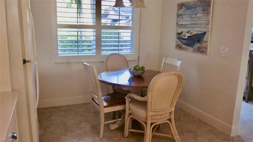 Dining room featuring baseboards and light tile patterned floors