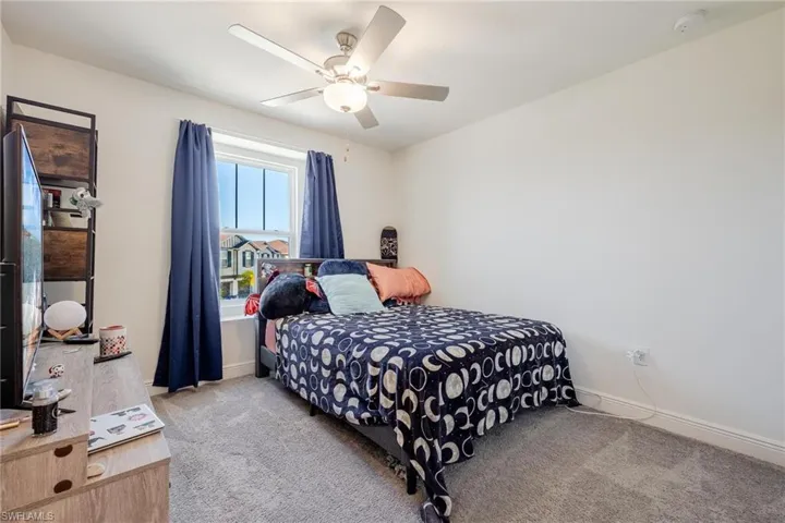 Bedroom #1 featuring ceiling fan and walk in closet