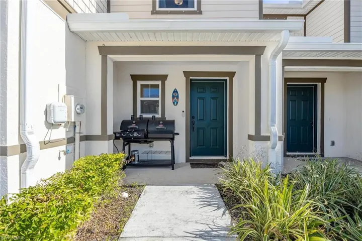 Doorway to property featuring a porch
