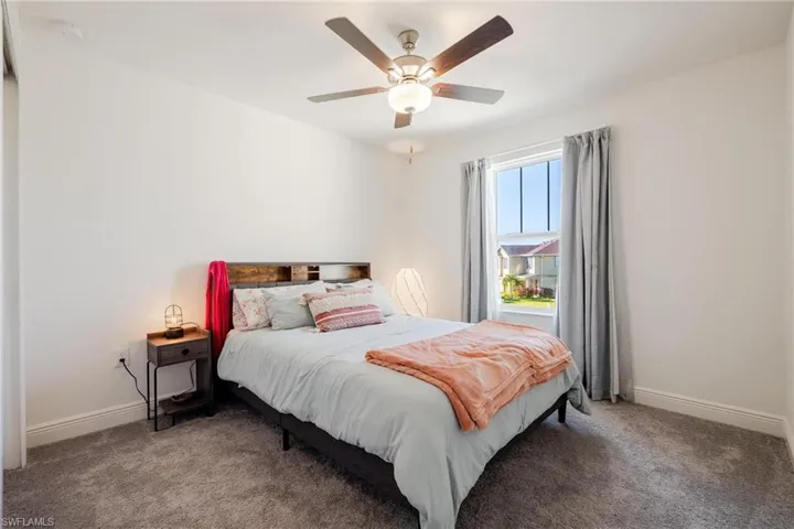 Bedroom #2 featuring ceiling fan and walk in closet