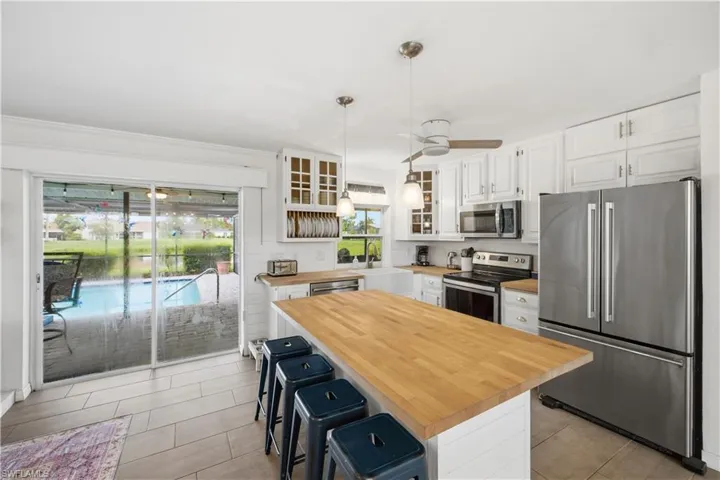 An amazing view of the pool and the lake from the kitchen