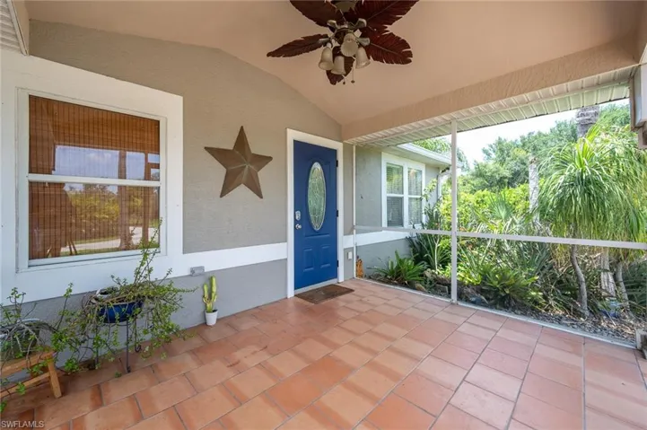 Unfurnished sunroom featuring ceiling fan