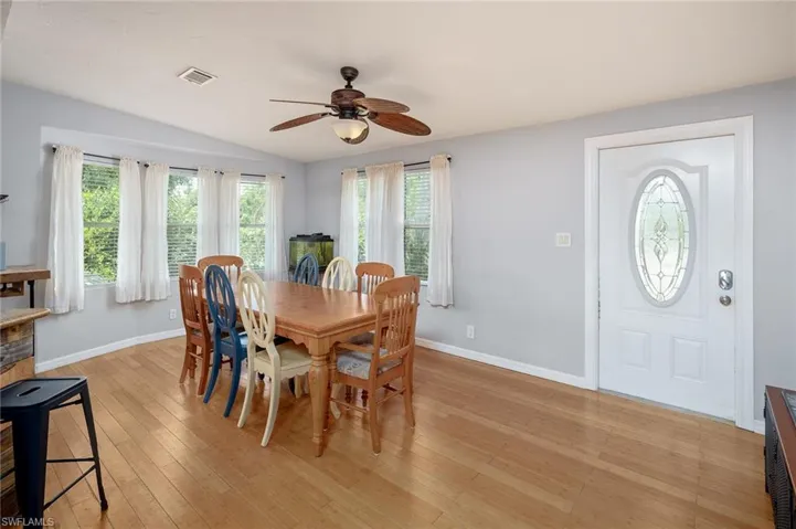 Dining space featuring ceiling fan and light hardwood / wood-style flooring