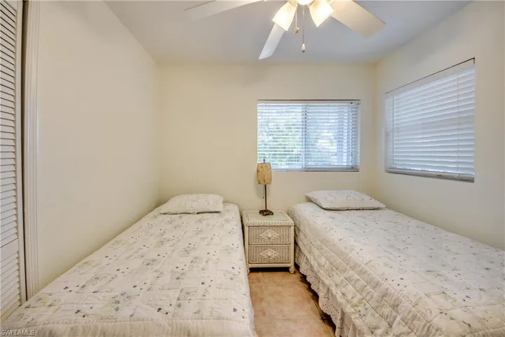 Tiled bedroom with ceiling fan