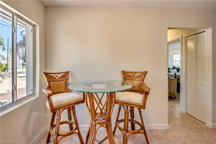 Dining space featuring light tile patterned floors