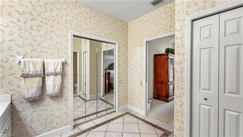 Bathroom with tile patterned flooring and vanity