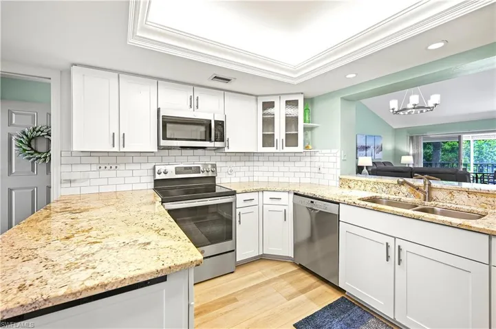 Clean and modern kitchen with stainless steel appliances.