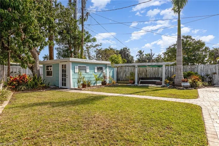 View of yard with an outbuilding and a fenced backyard