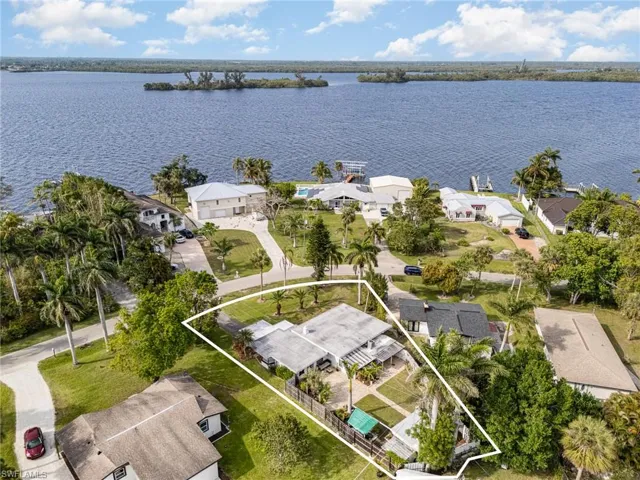 Bird's eye view with a water view and a residential view
