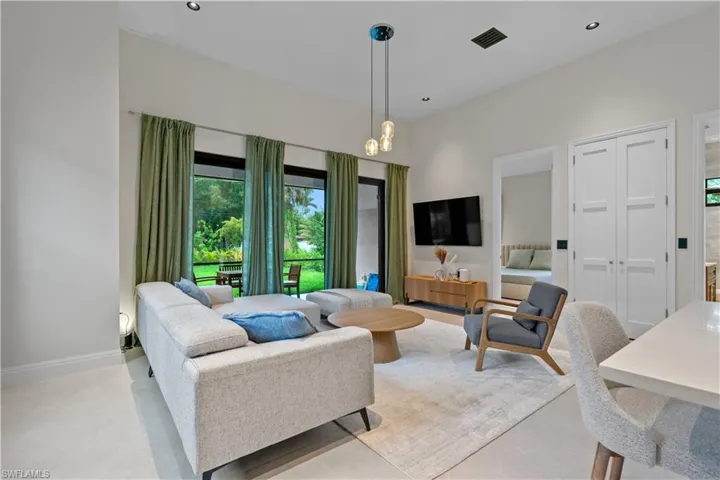 Living area with baseboards and recessed lighting