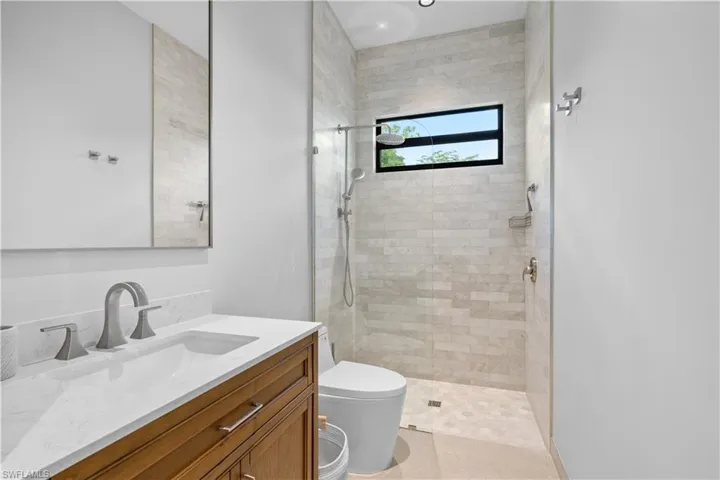 Bathroom with vanity and a walk in shower