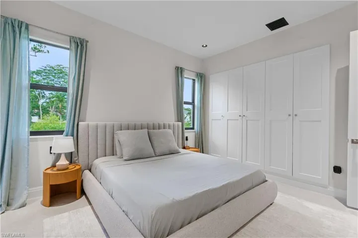 Bedroom with baseboards and carpet floors