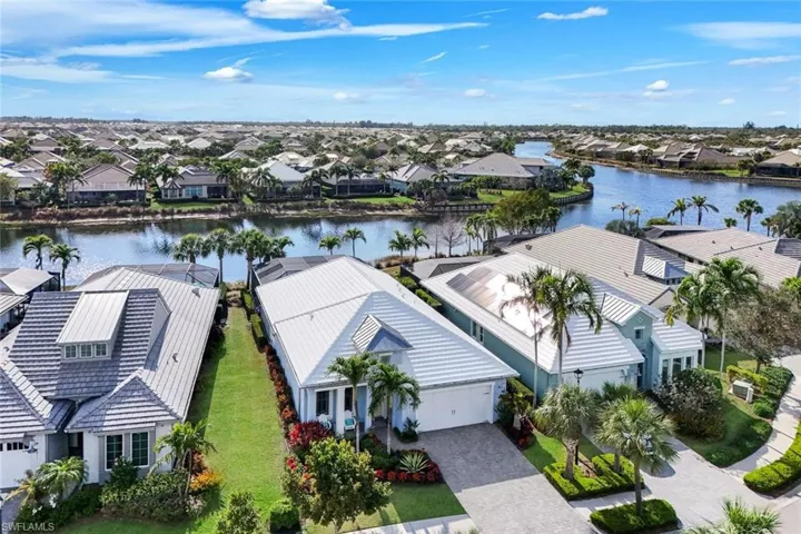 Aerial perspective of suburban area with a nearby body of water
