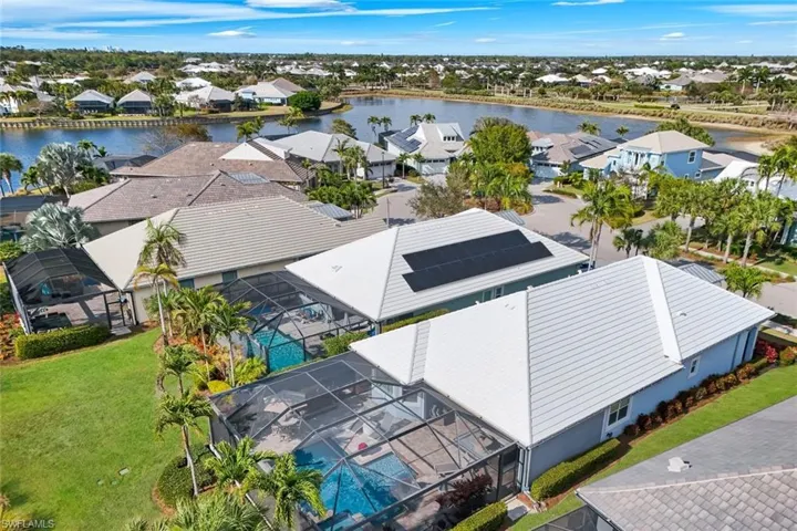 Aerial perspective of suburban area with a large body of water